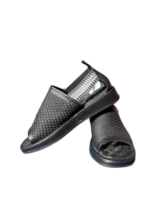 The image shows a pair of black men’s summer slip-on sandals. The sandals have an open toe and a tightly woven pattern on the upper. One sandal is upright, the other leans against it sideways. 